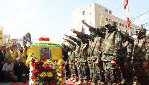 Hezbollah Military Salutes Al Hajj Coffin (Photo Credit: Al Manar)