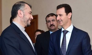 Hossein Amir-Abdollahian with Bashar al-Assad in Damascus in September (Photo Credit - AP)