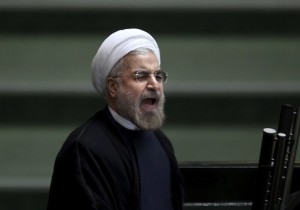 Iranian President Hasan Rouhani speaks before parliament, in Tehran, 2013. (AP Photo/Ebrahim Noroozi)