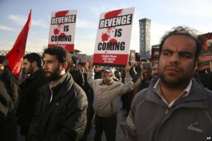 Iranian demonstrators hold anti-Saudi signs proming revenge for the execution of al-Nimr (Photo Credit - AP )