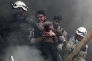 Boy rescued from under the rubble after Russia barrel bombs Aleppo (Photo Credit- Reuters)