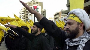 Hezbollah fighters take an oath during a parade to continue the path of resistance against Israel. (photo credit- AP:Hussein Malla)