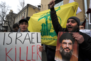 Protestors shout anti-Israel slogans in front of the Israeli embassy holding a portrait of Hezbollah leader Hassan Nasrallah in Moscow in 2012 (Photo- AFP)